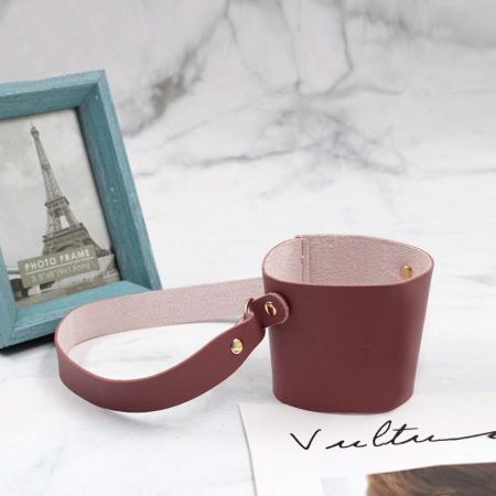 Our leather cup holder is the perfect addition to any desk, and it is made of PU leather or genuine leather and is custom-made to your specifications. The custom leather cup holder is the perfect way to keep your cups and mugs organized and within reach.