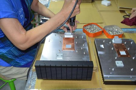 Assembling industrial computer chassis.
