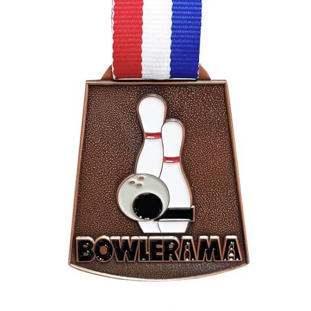 Custom Medals for Bowlerama - The bowlerama medal made by stamped brass is the most classic style of custom medals. The most popular size for medals is about 1 ~ 2″. Antique finishing made all the details more readable. If there’s a requirement for medal ribbon color, you are welcome to send us the PMS color you want and complete your medals with a fully printed ribbon. We have small minimum order quantities and various logo processes methods, it makes easier than ever for anyone to order.  When you are ready to order medals for your business, just contact us.