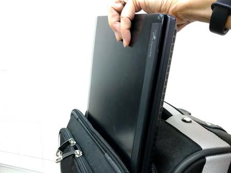 Acess the laptop without completely opening the main compartment.