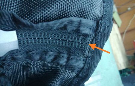 Nylon zippers inside pockets prick end users' hands