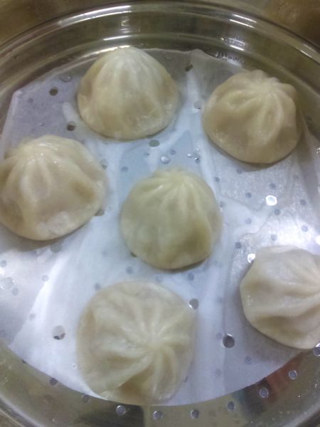 After adjusting, the client is satisfied with the taste and shape of the soup dumplings.