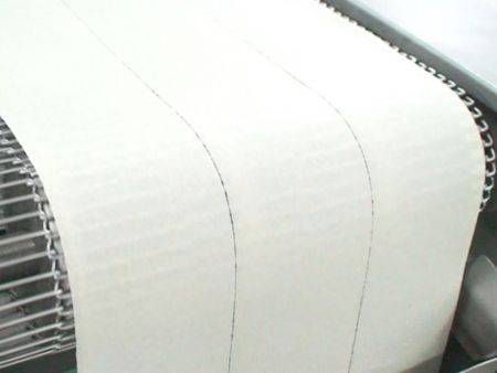 Baked wrapper sheet is evenly divided by the rolling cutter