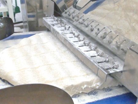 Pressing dough into a flat sheet