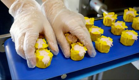 Proper spacing between shumai helps workers pick and place shumai easier