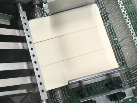 The machine automatically divides and stacks wrapper sheets