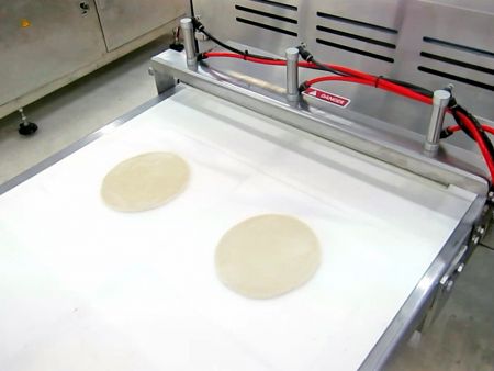 Using ANKO’s PP-2 to flatten the dough balls