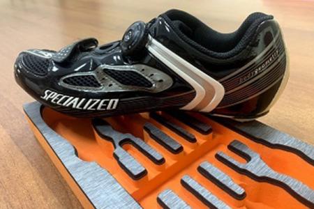 Cycling shoes made by our mid sole and tool box with decoration.