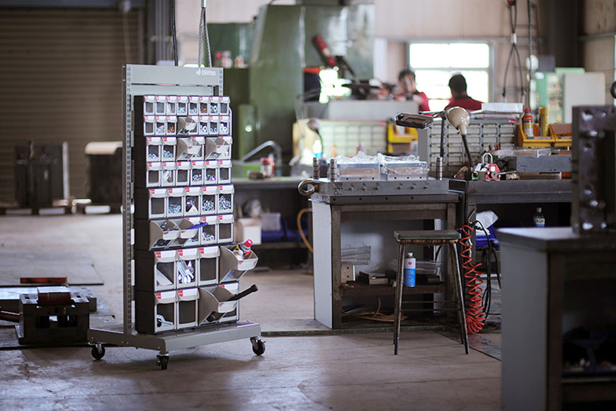 SHUTER flip-out bin mobile stands are manufactured with efficient hardware storage in mind.