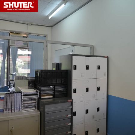 SHUTER metal storage locker with 12  compartments in office