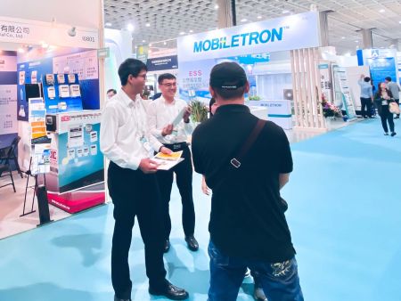 Representatives of CIC (Challenge Industrial Co., Ltd.) and FLUKE, interacting with a guest at "2019 Energy Taiwan" Exhibition