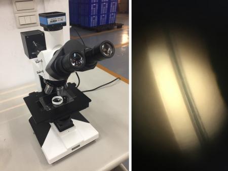 Mikroskop prüfen die Dicke der mehrschichtigen Schlauchhülse